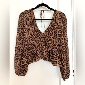H&M leopard print blouse. New with tags on. Size M.